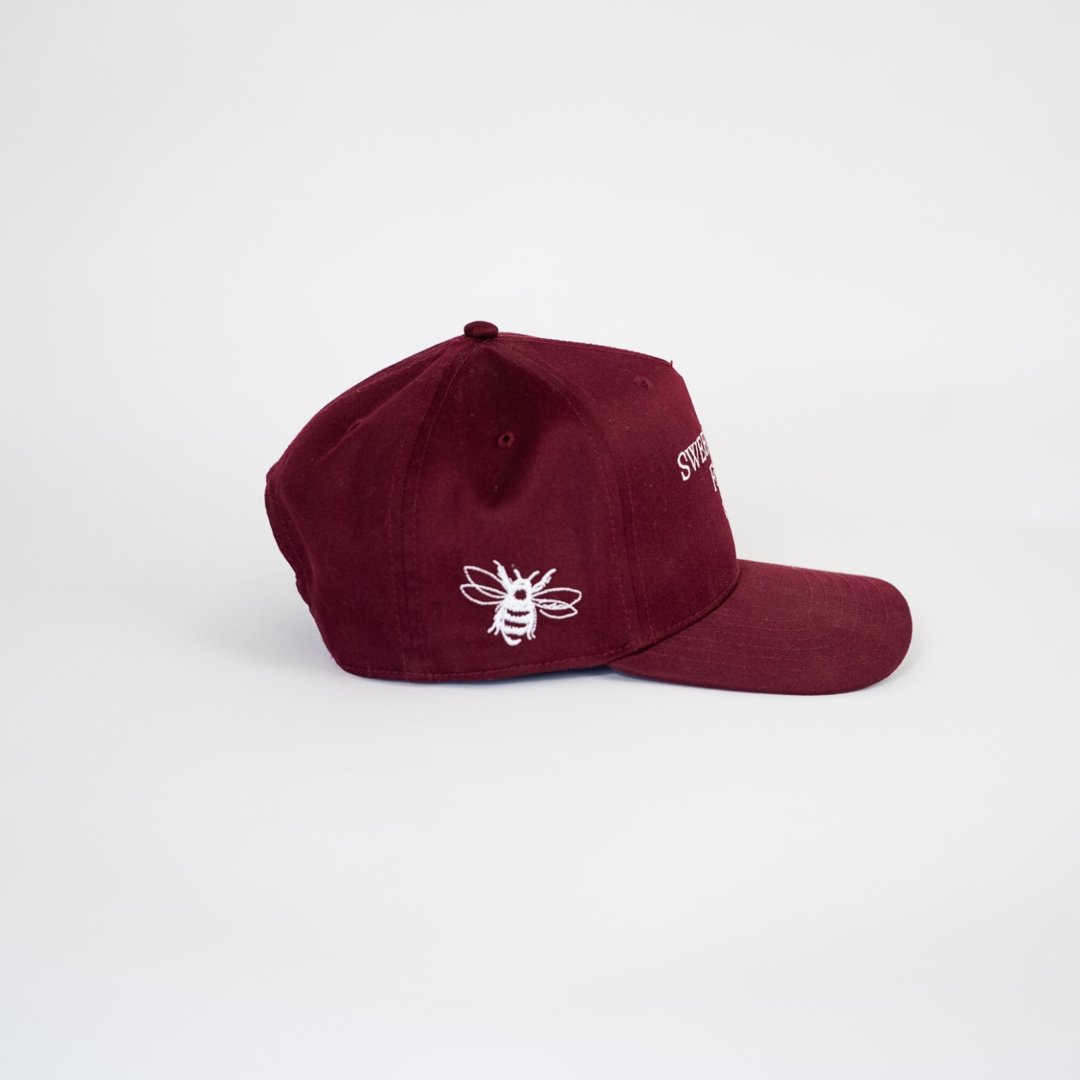 Side profile of The Every Day Hat maroon 5-panel snapback – Sweet Honey Farm