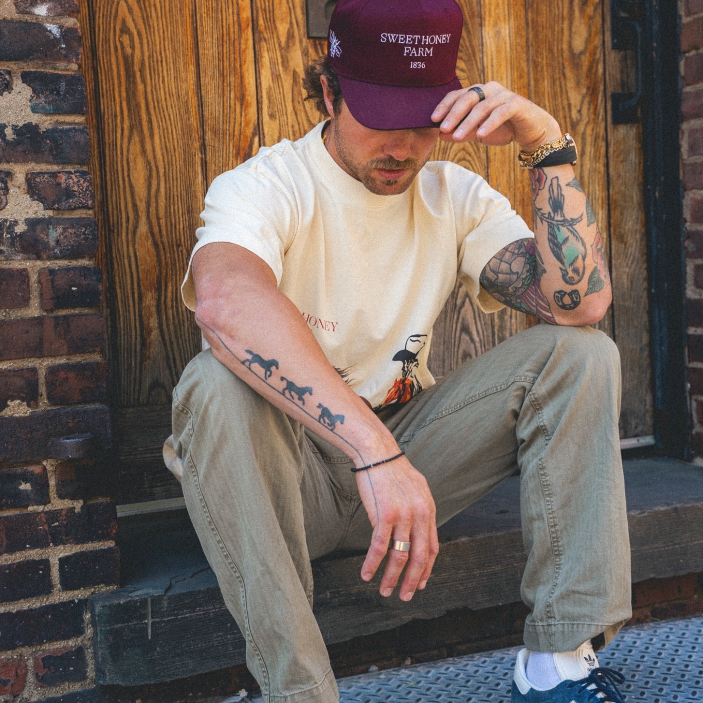Devon Levesque wearing The Every Day Hat, sitting head down – Sweet Honey Farm