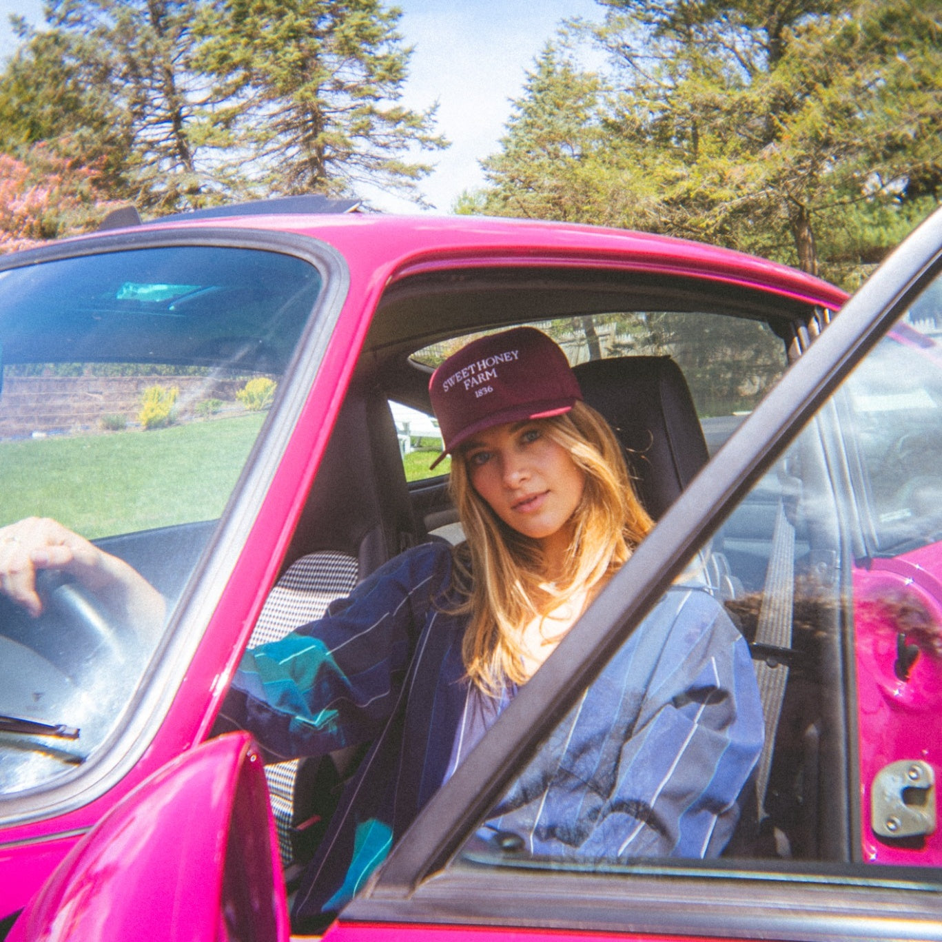 Woman in pink car wearing The Every Day Hat – Sweet Honey Farm